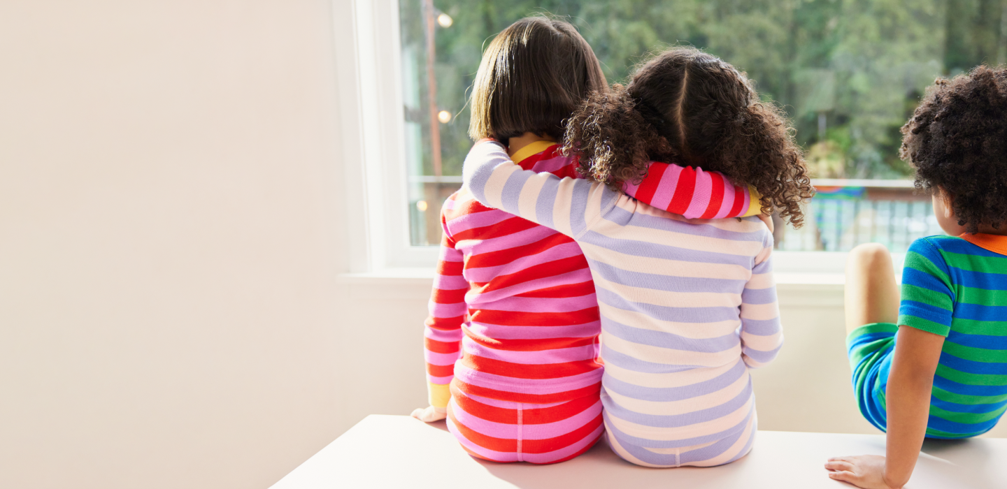 Children wearing striped pajamas spending time together